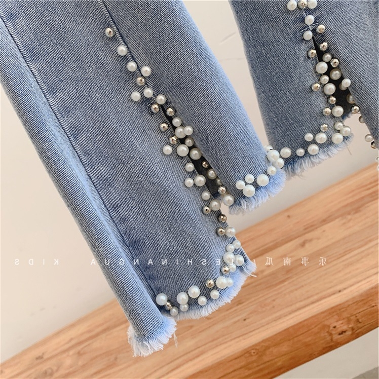 Детские джинсы с жемчугом и кружевами оптом из Китая