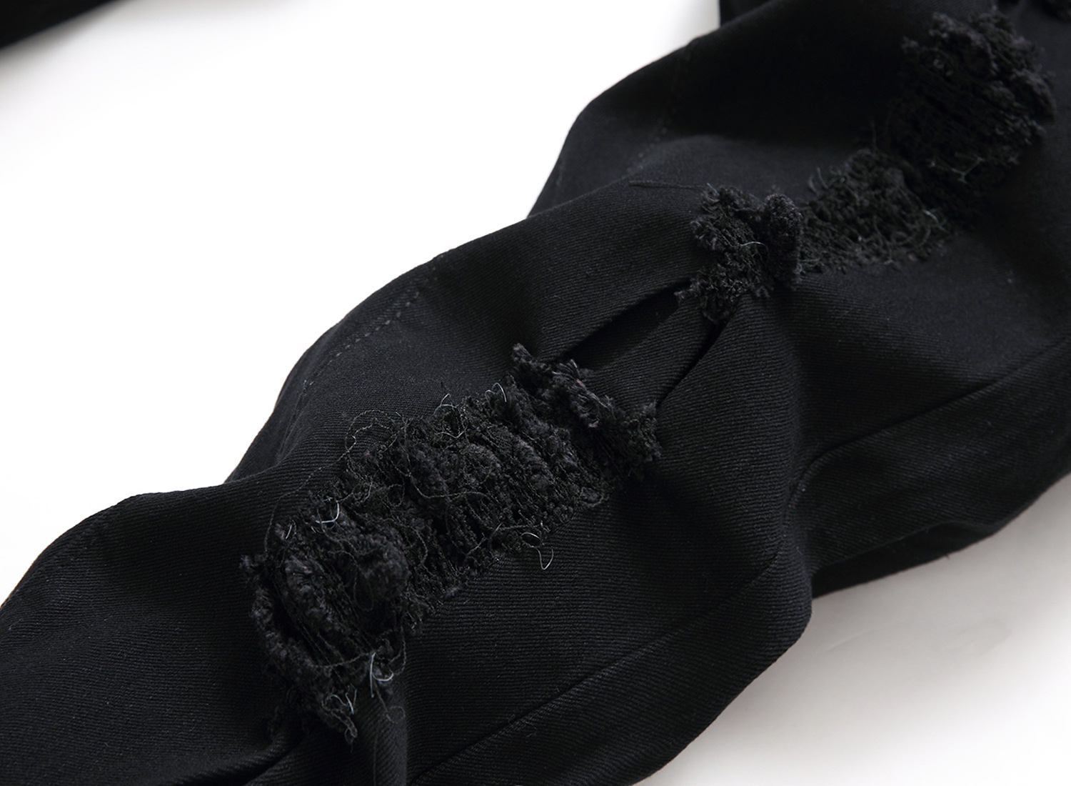 Мужские джинсы с разрывами и зауженными штанинами оптом из Китая