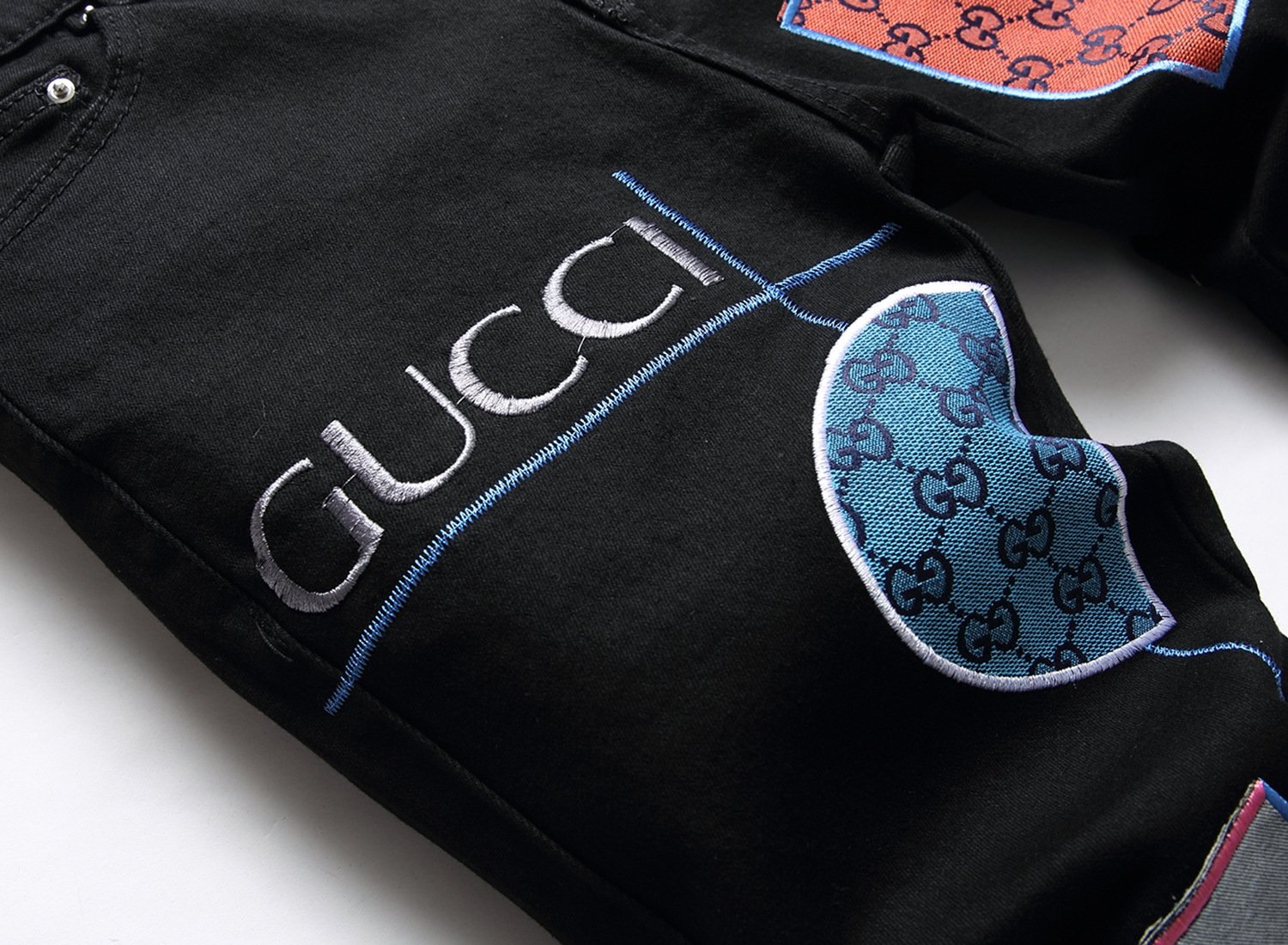 Мужские джинсы с вышивкой и принтом оптом из Китая