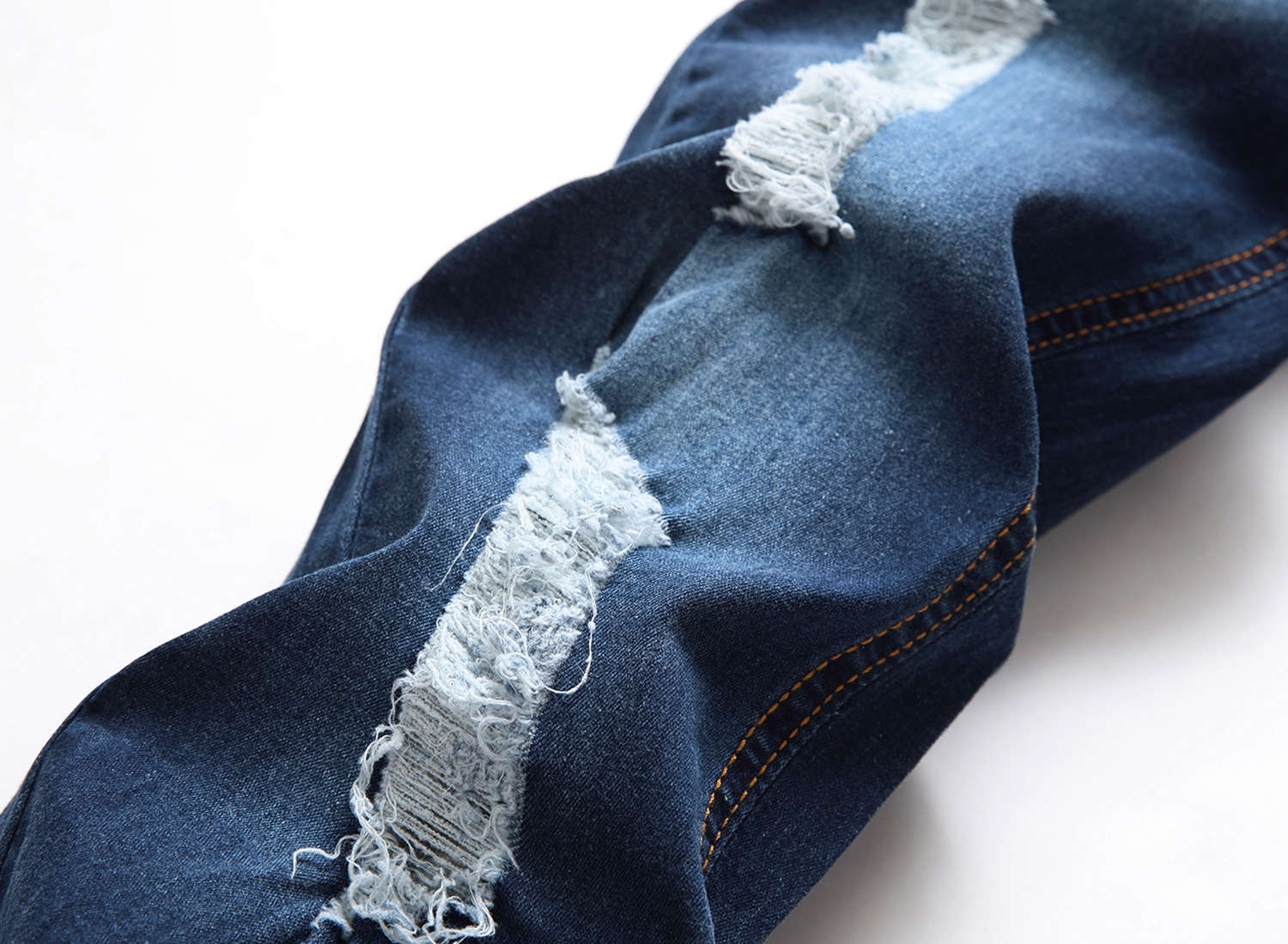 Мужские джинсы с разрывами и зауженными штанинами оптом из Китая