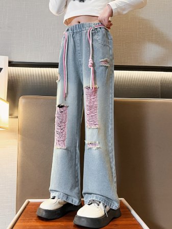Джинсы для девочек 2023 весна и осень новые детские брюки корейской моды для девочек с дырками широкие брюки фотография