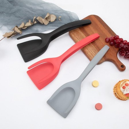 Нейлоновая лопатка для жареного мяса фотография