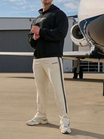 Повседневные мужские брюки с полосками и вышивкой фотография