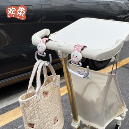 Крючок для коляски фотография