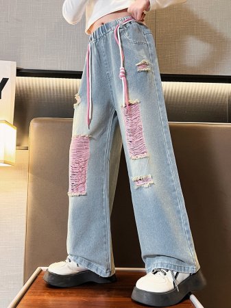 Джинсы для девочек 2023 весна и осень новые детские брюки корейской моды для девочек с дырками широкие брюки фотография