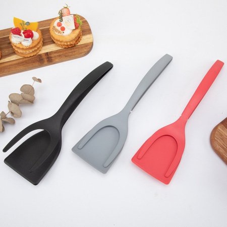 Нейлоновая лопатка для жареного мяса фотография